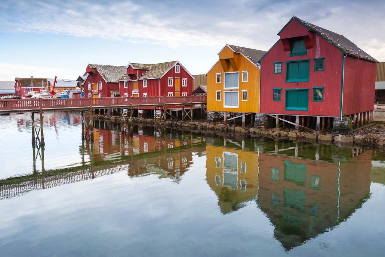 Red and yellow wooden houses in coastal Norwegian fishing village