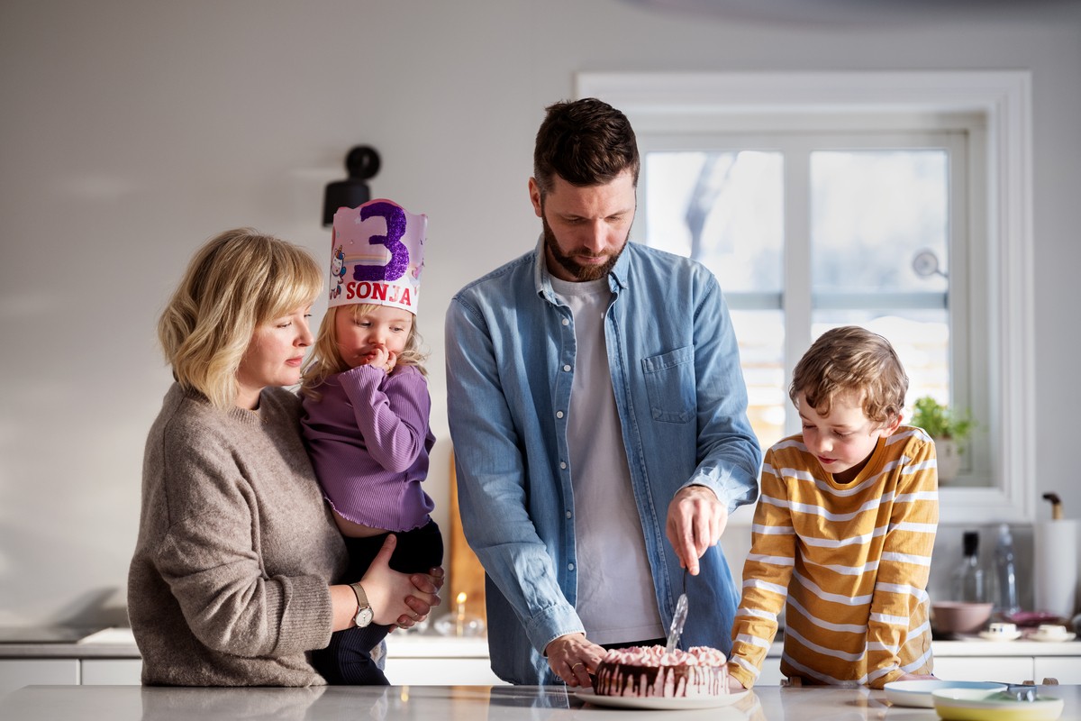 Calm relaxed mature older woman relaxing sitting on couch at home. Peaceful middle aged grey-haired lady resting on sofa in modern living room enjoying lounge and no stress, looking away, thinking.
